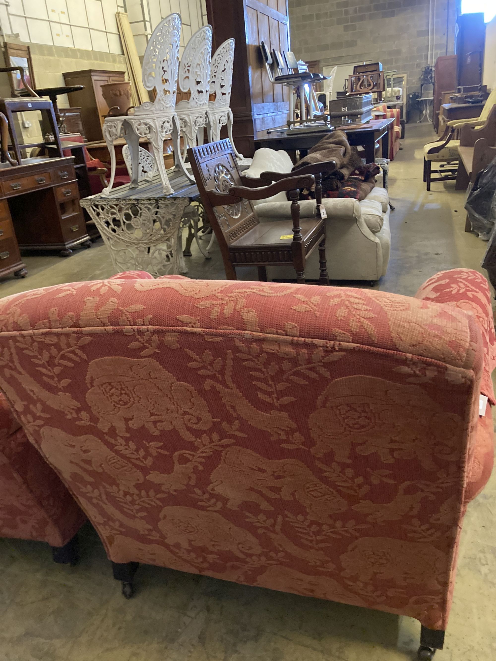 A pair of late Victorian style upholstered lounge armchairs, width 88cm, depth 98cm, height 83cm
